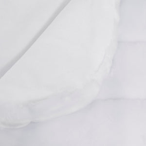 white faux fur blanket showing white cotton velour lining