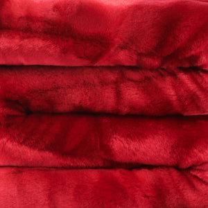 close up view of cherry red faux fur blanket