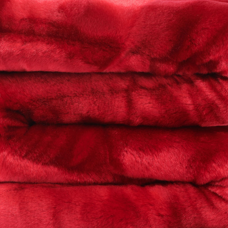 close up view of cherry red faux fur blanket