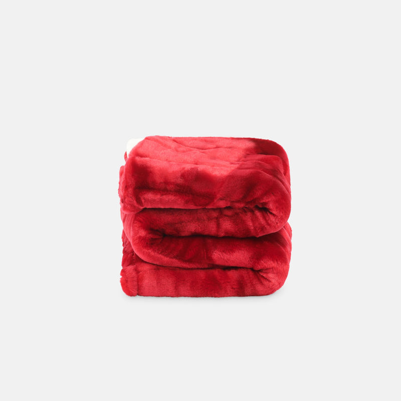 small folded minimink cherry red faux fur blanket on cream background