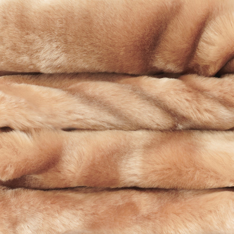 close up view of honey faux fur blanket