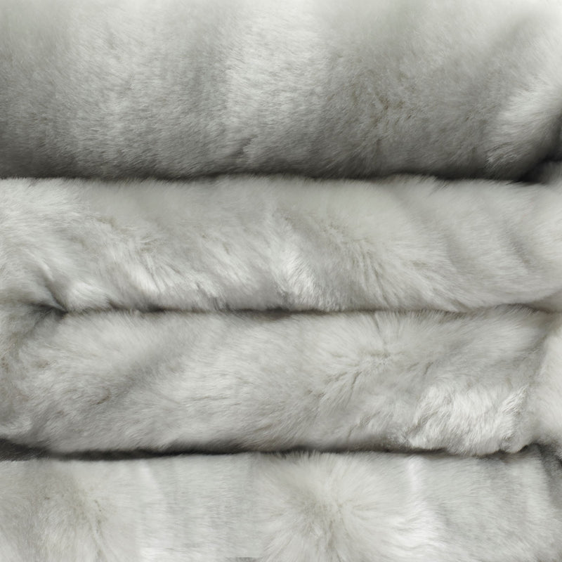 close up view of silver faux fur blanket