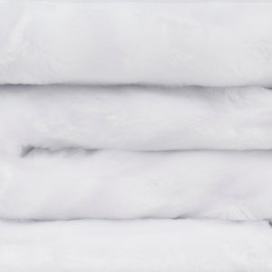 close up view of folded minimink white faux fur blanket