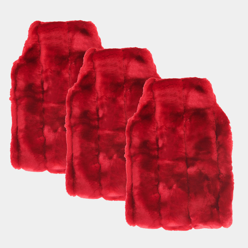 three faux fur hot water bottle covers in cherry red on cream background
